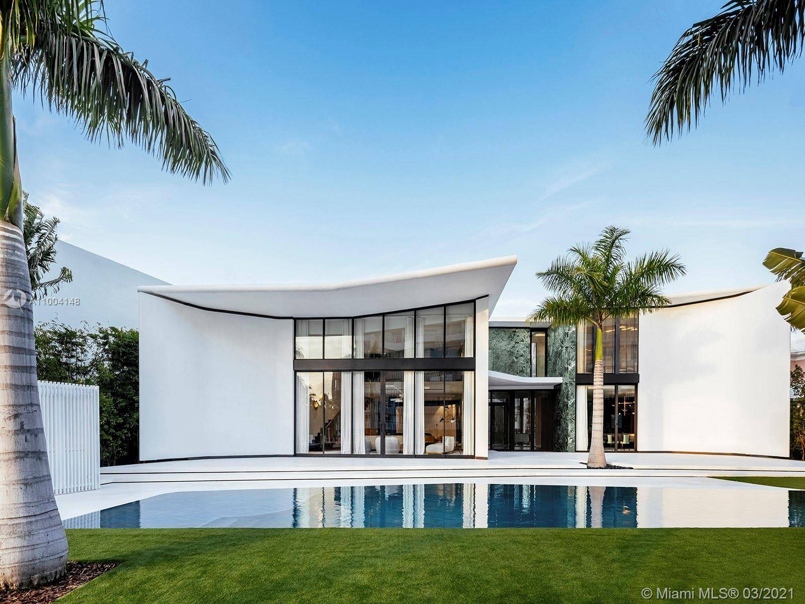 Sited in one of Miami Beach's exclusive enclaves, this private estate on Lakeview Drive features 111 feet of waterfront on Surprise Lake.