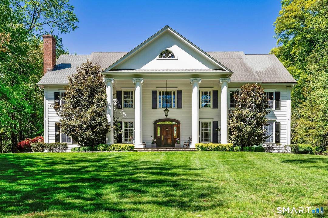 Exquisitely renovated center hall colonial set on two perfectly manicured acres at end of quiet, private cul de sac, offering exceptional space timeless appeal for both everyday living entertaining.
