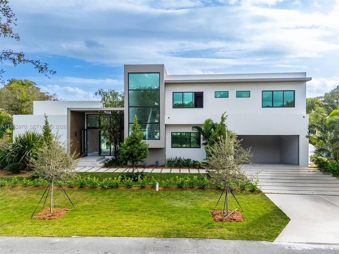 Introducing a distinguished new construction on a premier corner lot in the heart of Pinecrest, where timeless elegance meets modern design.