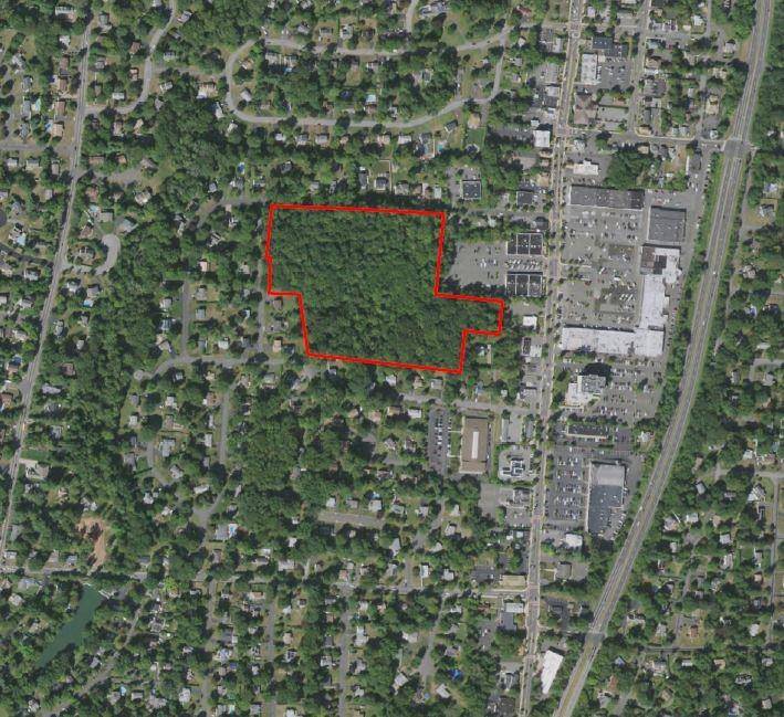 55 Schriever Lane, a rare and exciting opportunity to own a prime piece of land right in the heart of town, ripe for development.