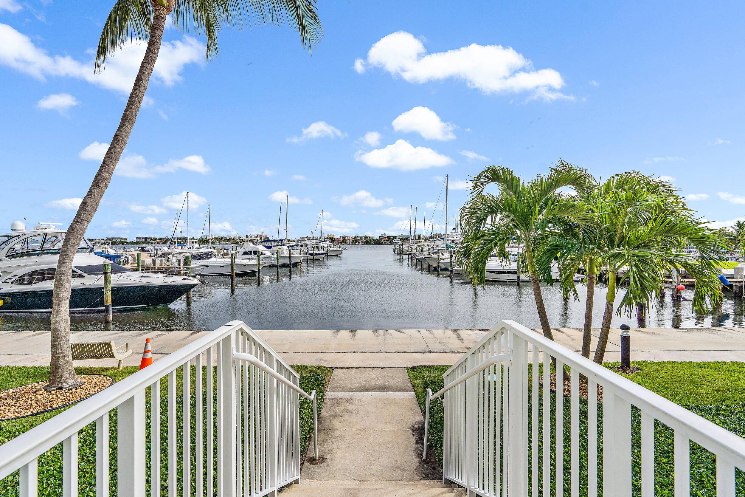 Located on the first floor, this 2 bedroom, 1 bathroom residence offers stunning intracoastal, pool, and hot tub views from within the most coveted building in The Moorings community.