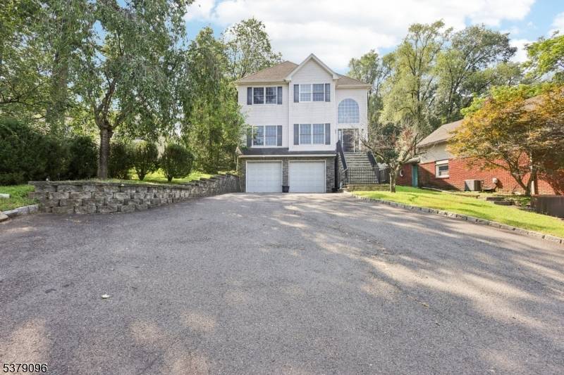 Welcome to 91 Mountain Blvd, a beautifully maintained, spacious and inviting 4 beds 3.