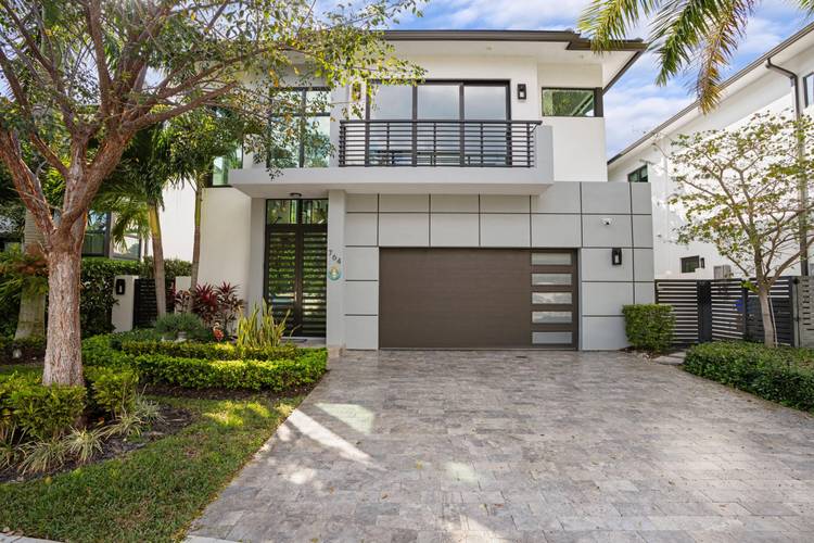 Situated on a premium lot in East Delray's La Hacienda, this 4BR 4.
