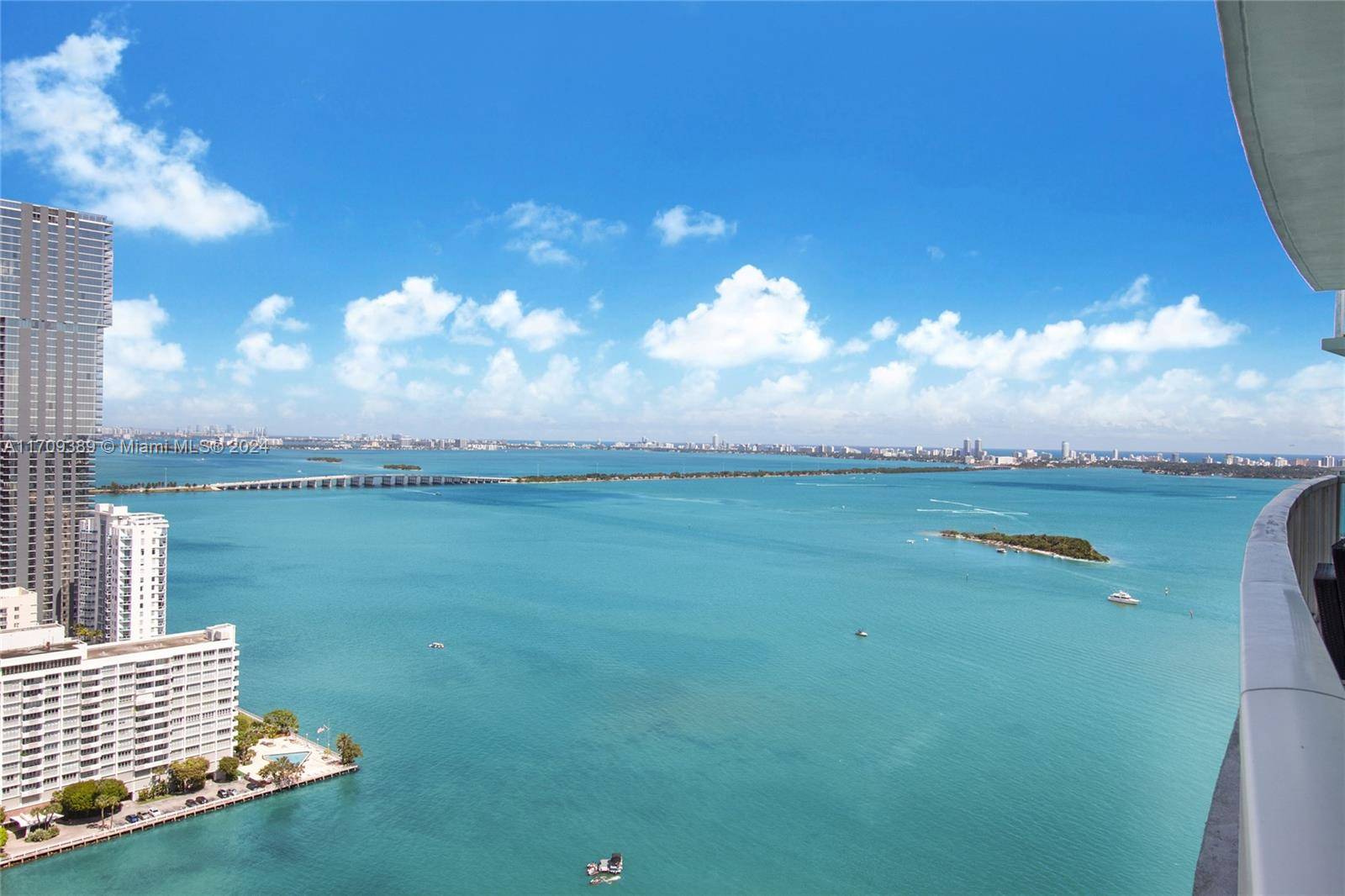 This is your chance to move in to your very own direct water view, new construction residence in the sky of your dreams at Quantum on the Bay !