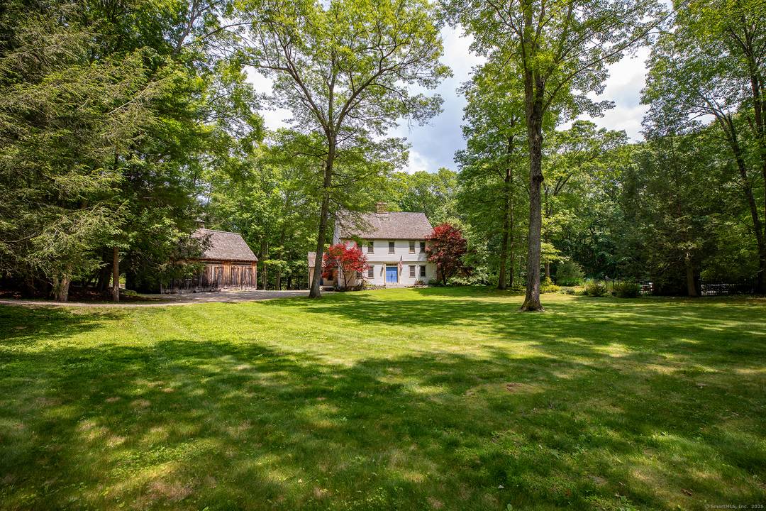 Mint 6 bedroom colonial reproduction on scenic dirt road.