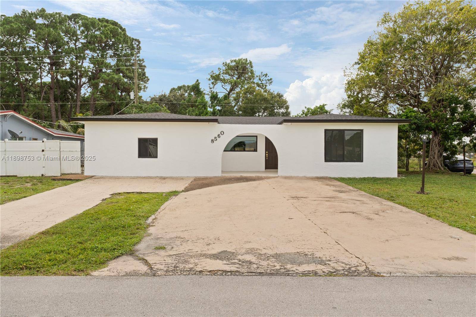 This stunning 4 bedroom, 3 bath residence features two spacious master suites and a convenient cabana bathroom.