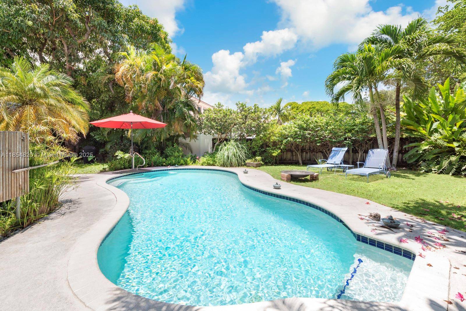 Charming Biscayne Park oasis with artisan craftsmanship and lush outdoor living.