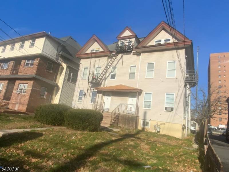 Elmora section apartment building for sale total of 14 units, 8 studios, 6 one bedrooms and 8 parking spaces with common driveway.