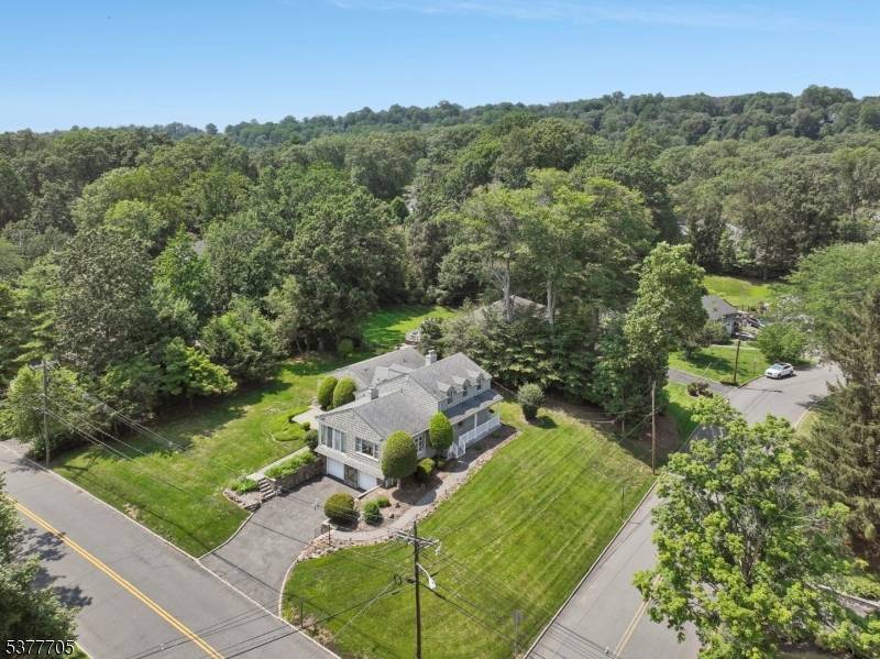 This distinctive custom built home offers four bedrooms, 3.