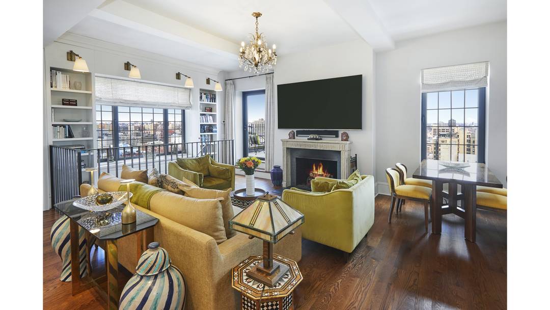 Perched high above Central Park, this sunlit duplex offers a rare and expansive perspective over the city like a private perch in the sky.