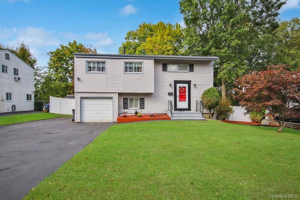 Discover the perfect blend of sought after location and flexible living in this charming four bedroom split level residence.