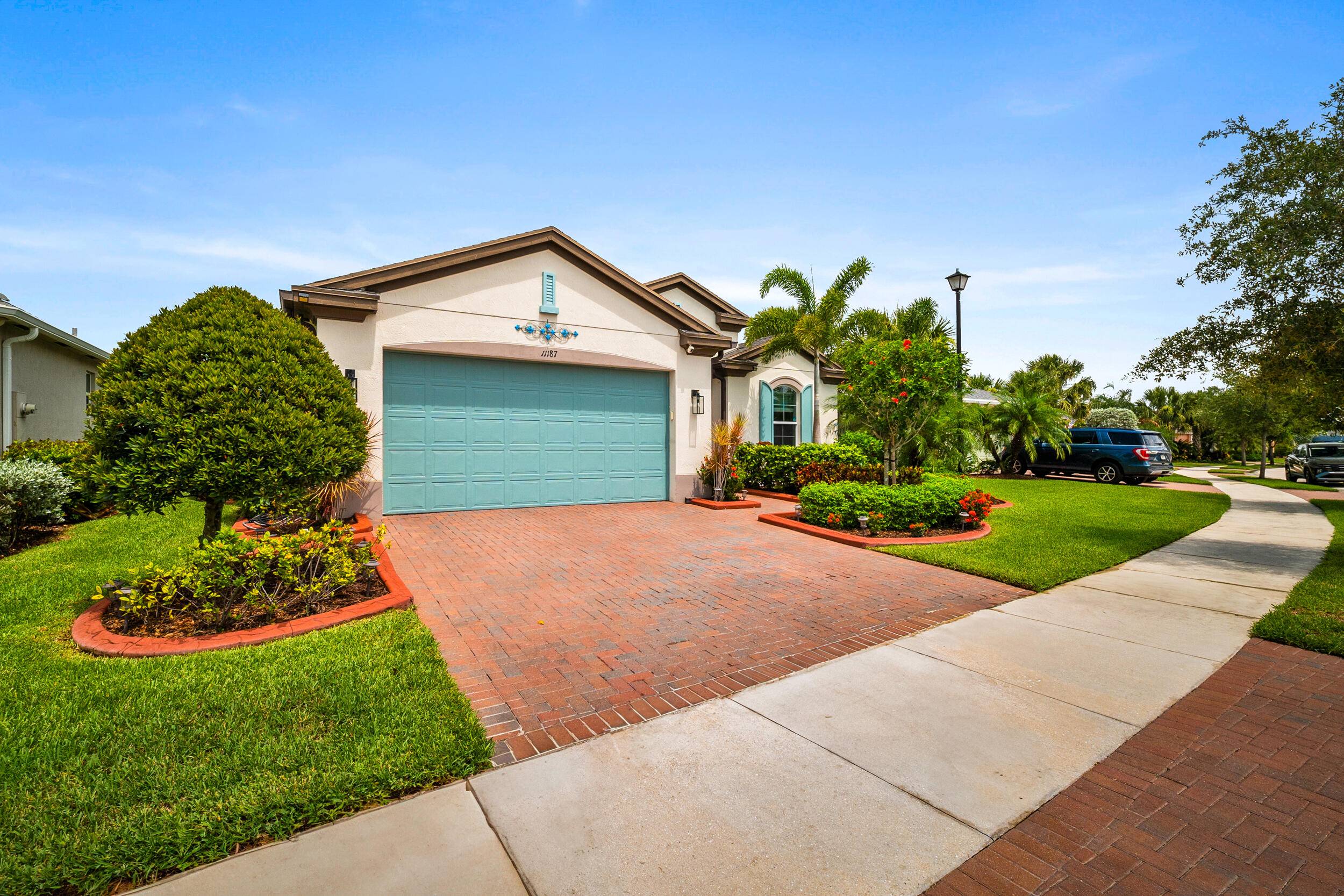Move in ready lakefront home on a premium lot in Lake Park at Tradition !