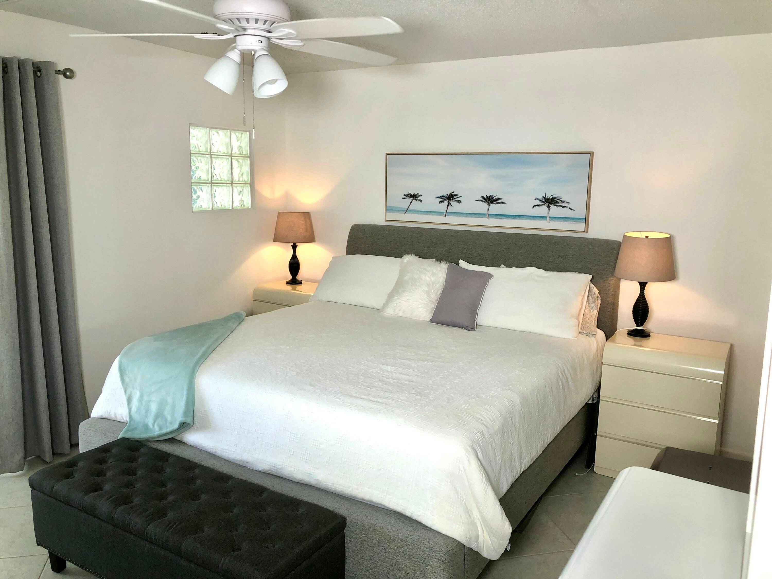 Condominium Featuring Lake ViewsThis condo offers a spacious bedroom with a beautiful view of the lake, in a peaceful and serene setting.
