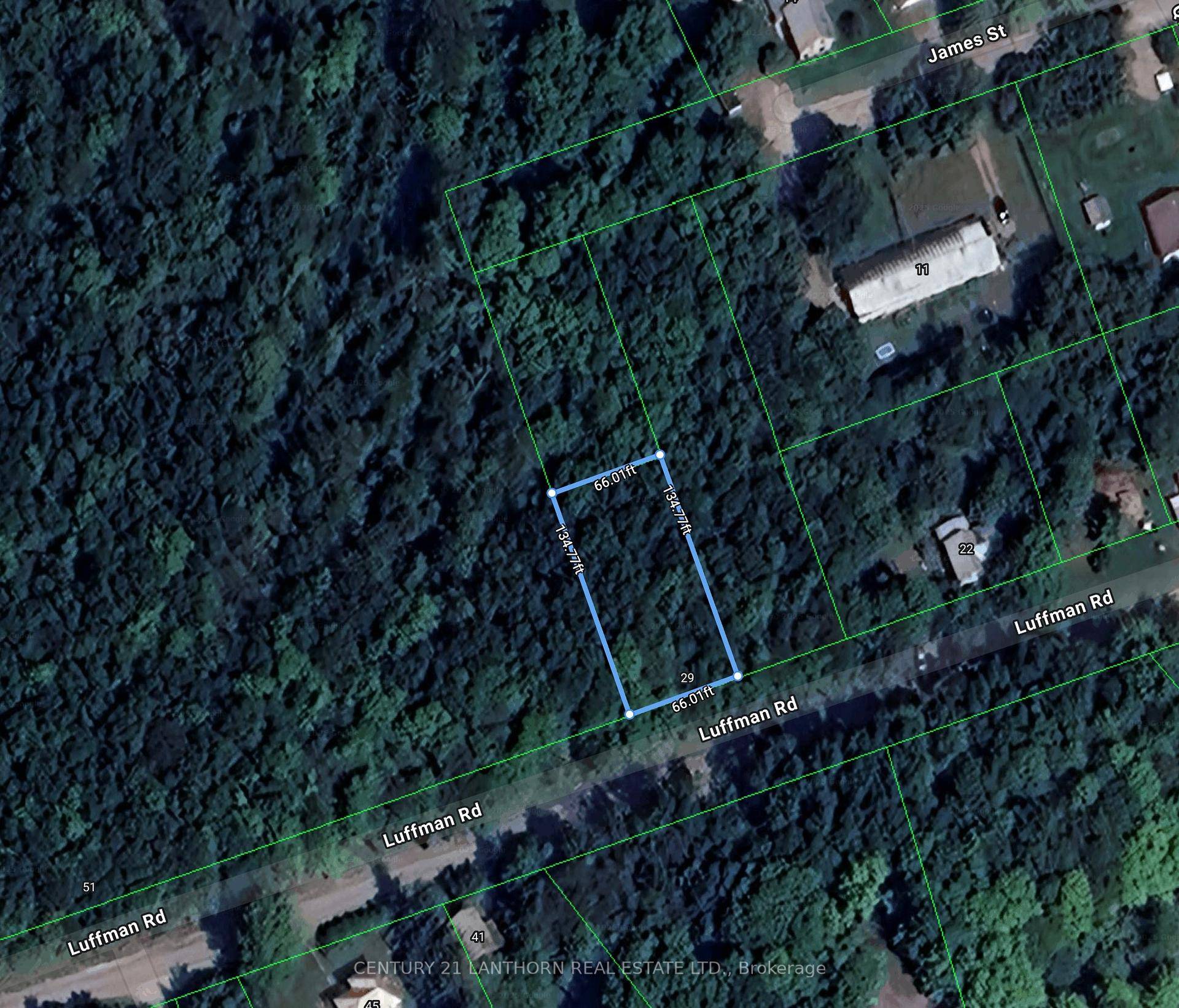 In town lot available along a well treed section of paved road.