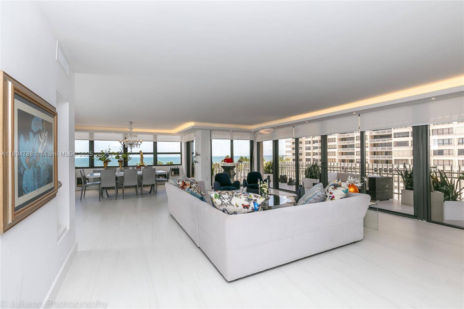 THE MOST EXCLUSIVELY AND TASTEFULLY RENOVATED UNIT AT GROVE ISLE WITH HIGH END FINISHES !