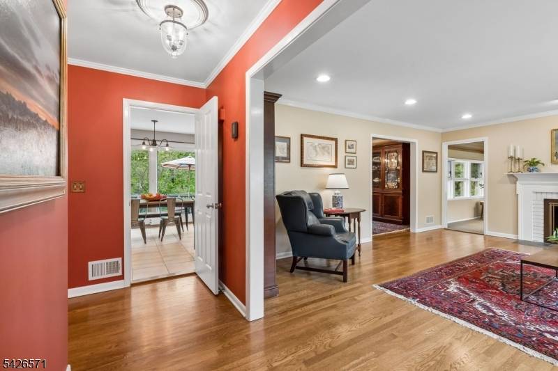 This meticulously maintained 1960's ranch is tucked away on a quiet cul de sac in the sought after Tall Oaks section of New Providence.
