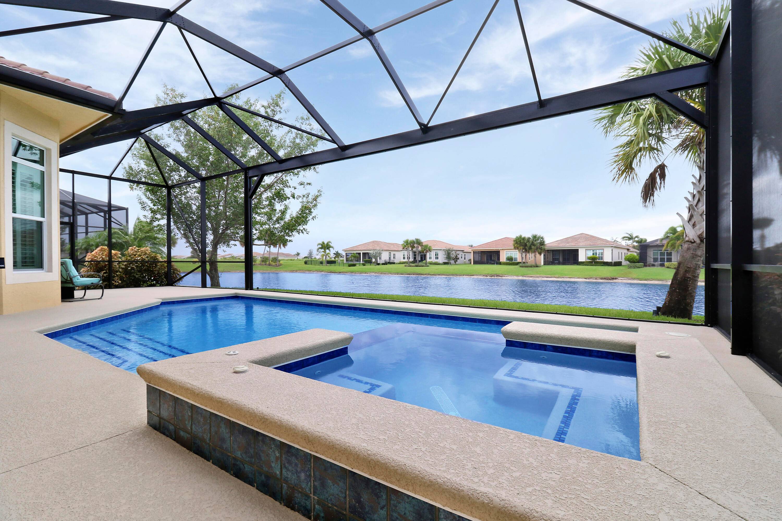 COME RELAX IN THIS WELCOMING LAKEFRONT POOL HOME IN PGA VERANO !