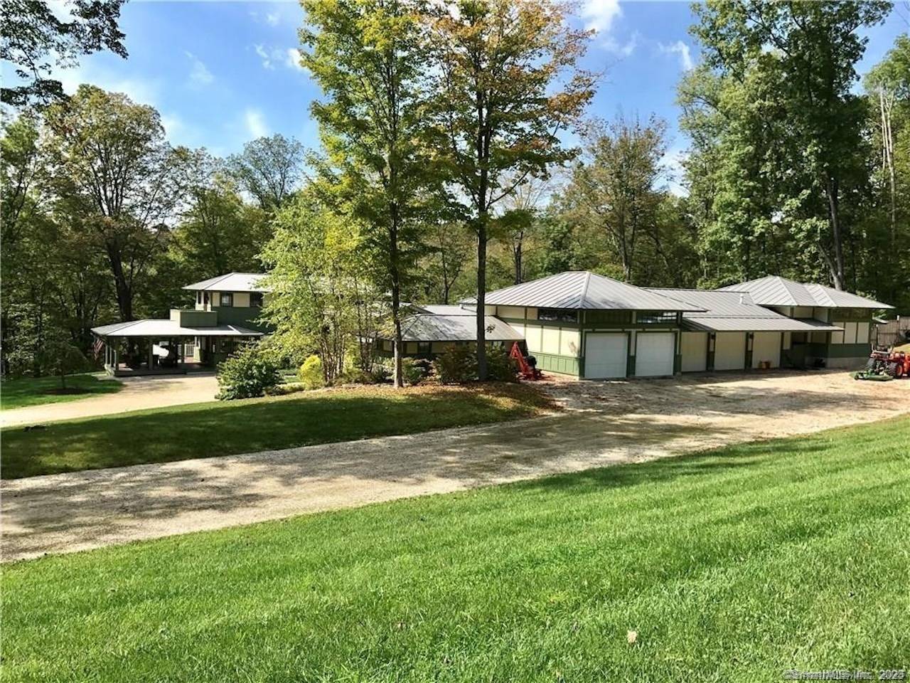 As you approach this radiant modern homestead, a gracefully winding driveway crosses the picturesque Jack brook on a newly restored wood trestle bridge, framed by specimen trees and meticulously crafted ...