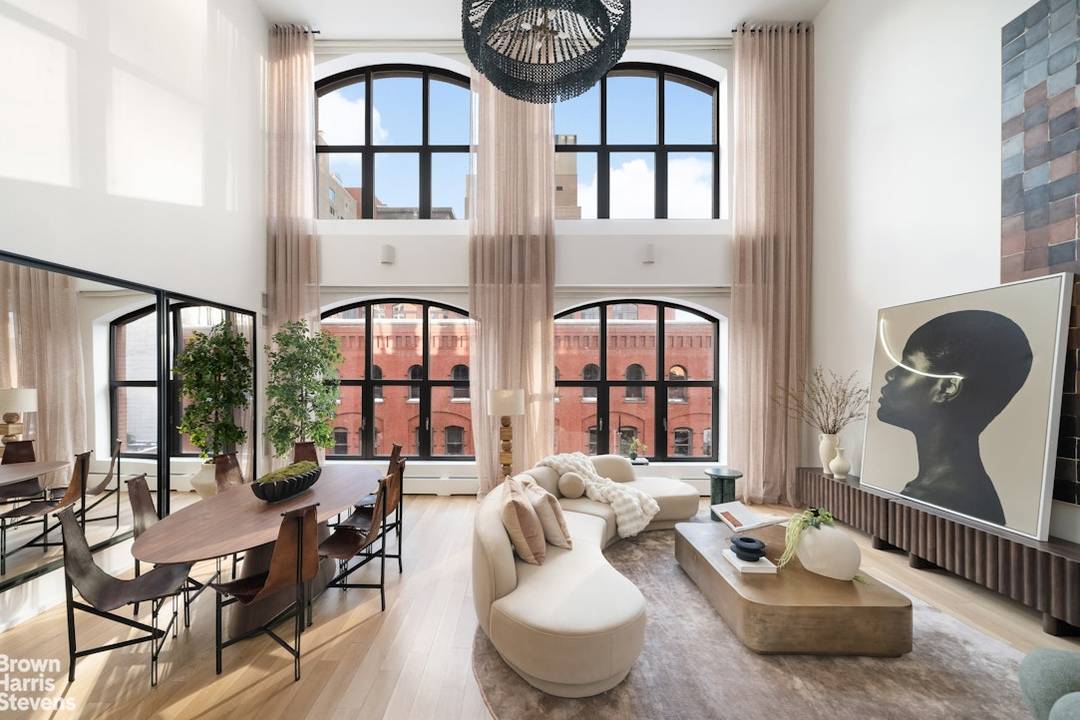 The moment the keyed elevator opens directly into 55 Vestry 5C, the feeling is immediate air, light, and an uncommon sense of calm.