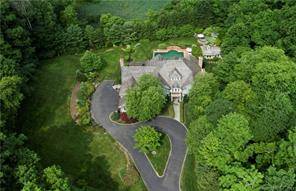 Better than new ! Magnificent 6 bedroom stone and shingle Colonial by famed Granoff Architects sited on a private 4.