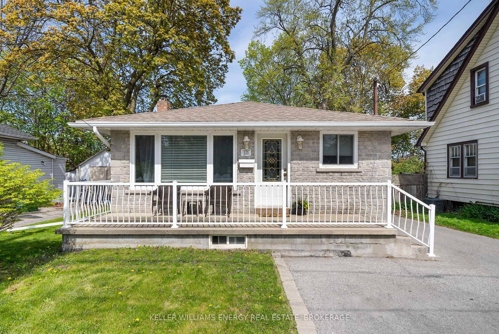 Welcome to 121 Harmony Road South a solid brick amp ; stone bungalow offering 3 1 bedrooms and 2 full bathrooms on an impressive 48.