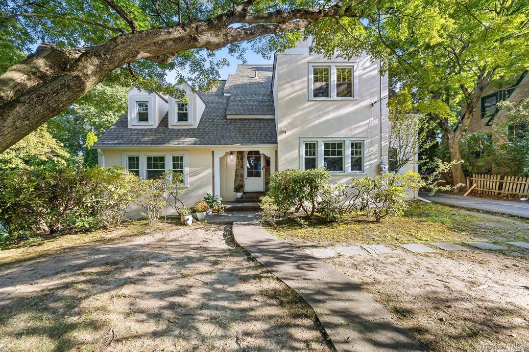 Nestled on a beautifully landscaped third of an acre at College Corner, this mint condition Tudor seamlessly combines timeless charm with modern updates.