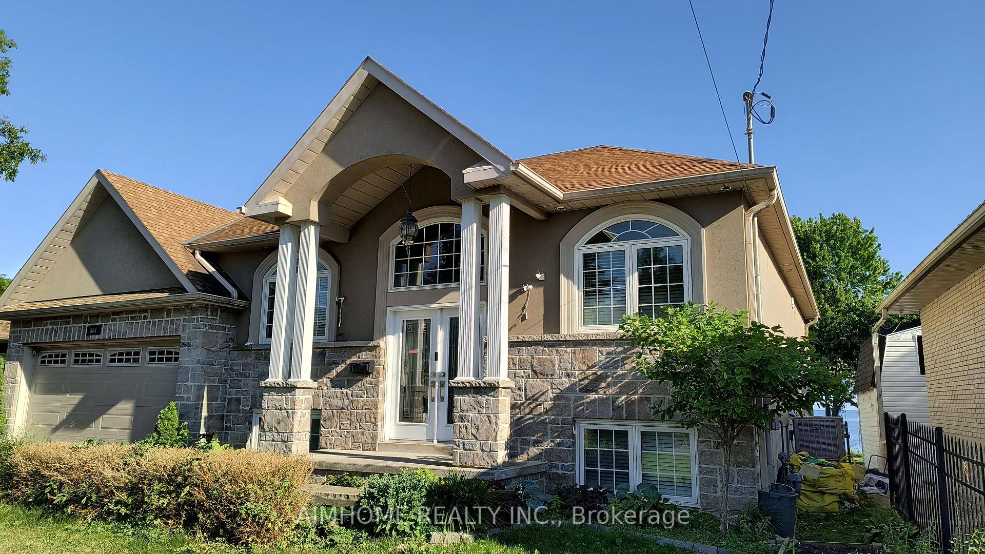 Discover the pinnacle of waterfront living in this beautifully crafted custom bungalow.