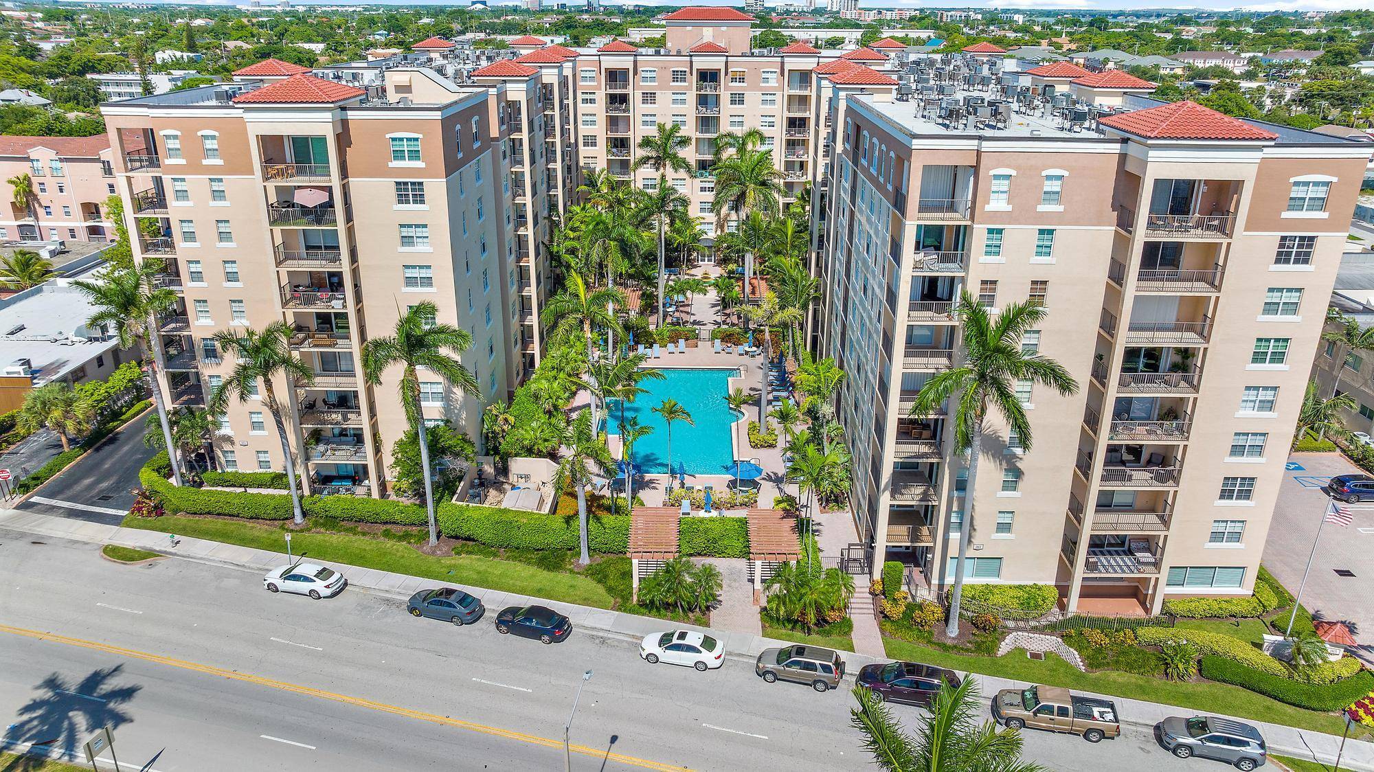 Beautiful two bedroom, one bathroom condo with wood laminate flooring, a private balcony, and an open layout.