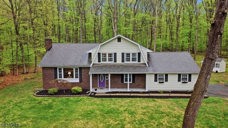 Welcome to this spacious 5 bedroom, 2 full and 1 half bath split colonial ideally located at the end of a quiet cul de sac and backed by peaceful woods ...