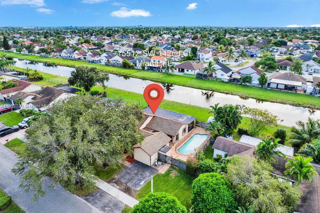 Rare 75 ft canal front 4BR 3BA grandfathered ADU in Richmond West !