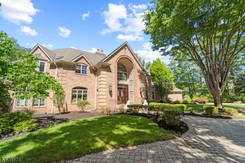 Set on a peaceful cul de sac with direct views of Lake Tappan, this distinguished French inspired residence offers approx.