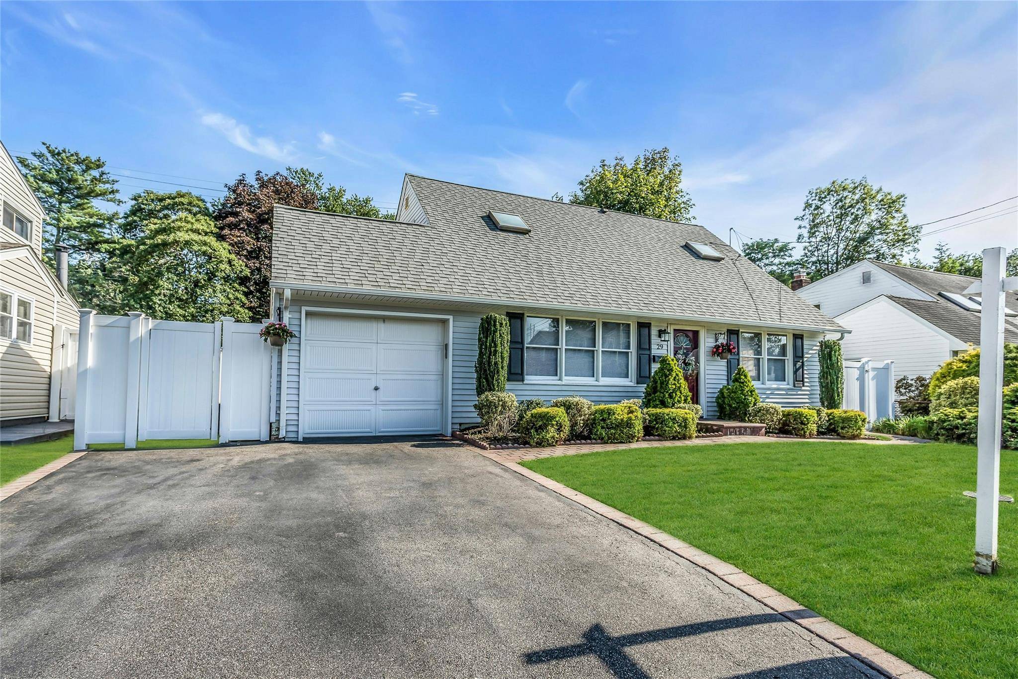 This expanded Cape, situated mid block on a flat, professionally landscaped lot, offers a perfect blend of comfort and easy living.