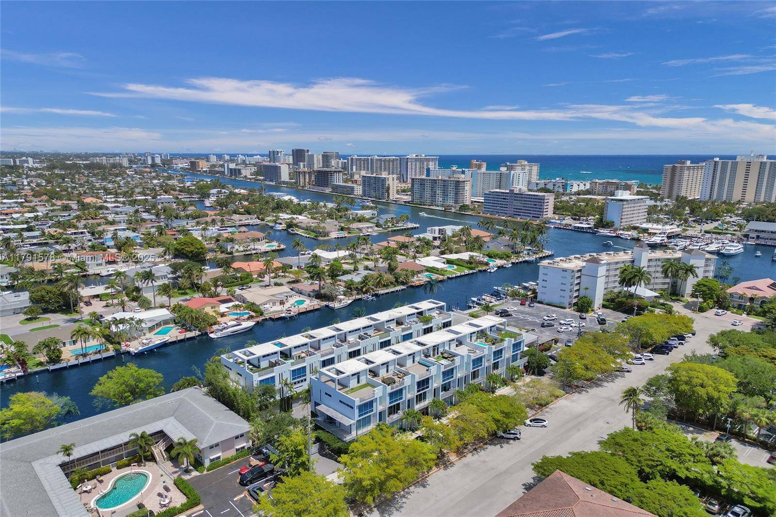 Modern 4 story townhouse in vibrant Pompano Beach, offering 3 bedrooms, 3.