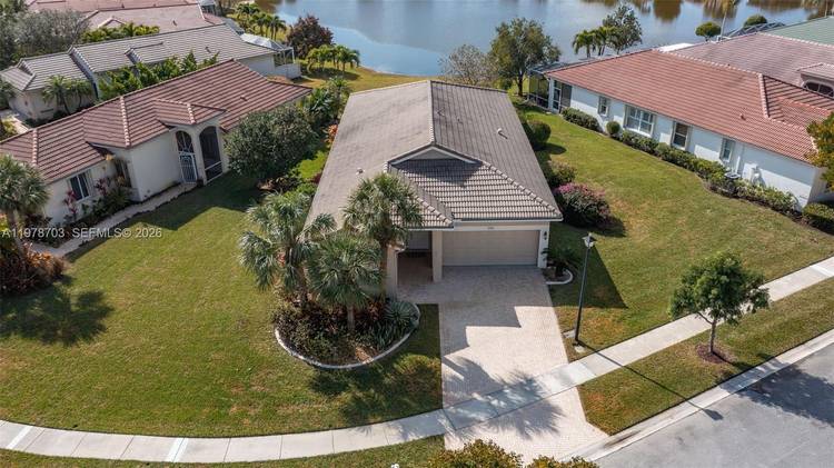 Welcome to this beautifully remodeled lakefront residence set on a rare oversized corner lot in the prestigious 55 community of Baywinds.