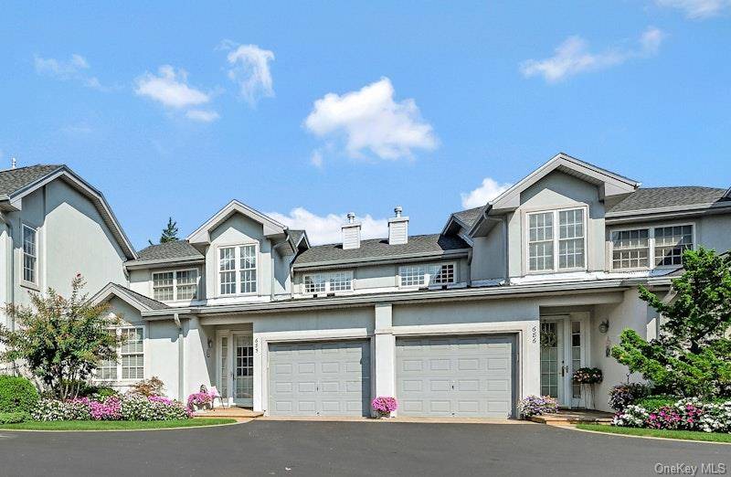 Designer owned and decorated unit is located in a private cul de sac at The Greens at Half Hollow.