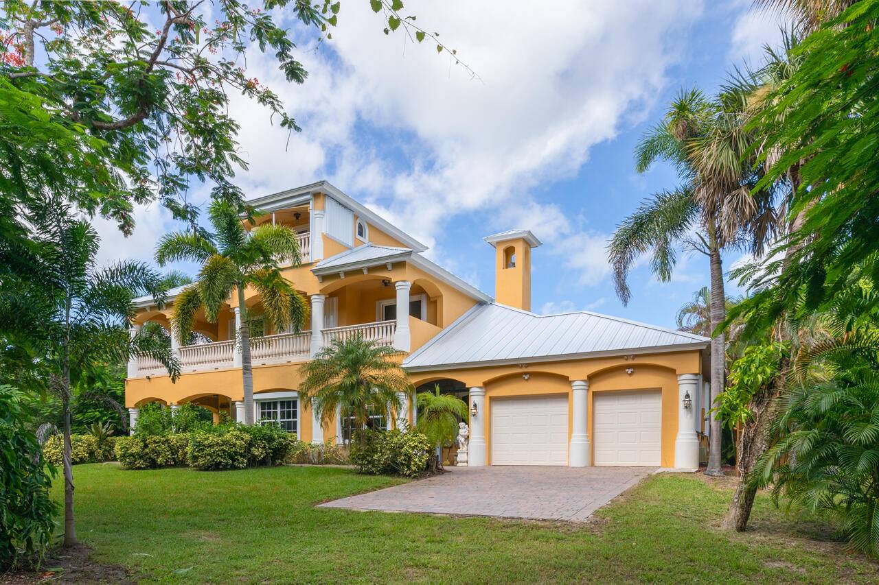 3 Acre Riverfront Estate Home w Att 2 Car Garage Plus Detached1600 Square Foot 4 Car Garage Under Air w Full Bath Gym Workshop, Generator, Car Port Concrete Pad.