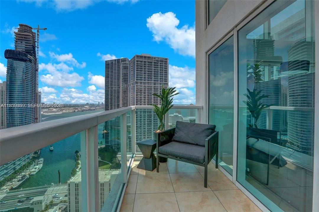 High floor corner loft style 2 story residence offering expansive, primary views of the ocean, bay, river, and Miami skyline from one of the highest floors in the building.