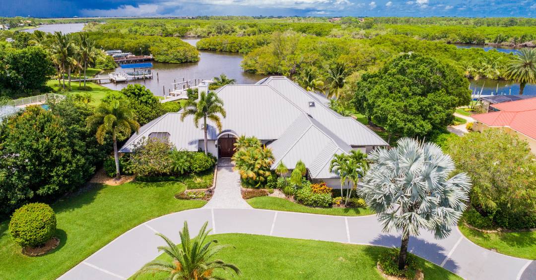 Spend winter in this amazing custom home on the water in Piper's Landing Yacht Country Club !