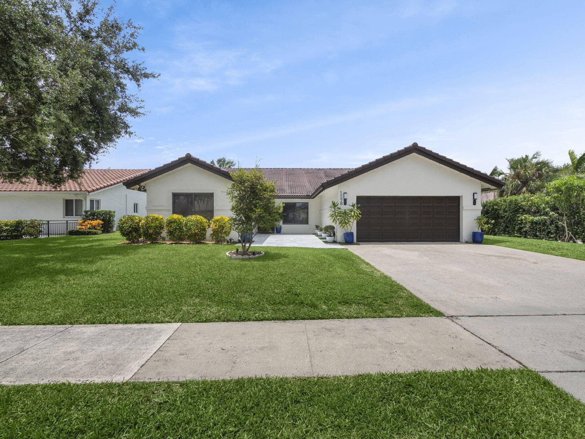 We present this magnificent 4 bedroom, 3 bathroom home located in the coveted and prestigious community of Palm Beach Farms, Boca Raton.