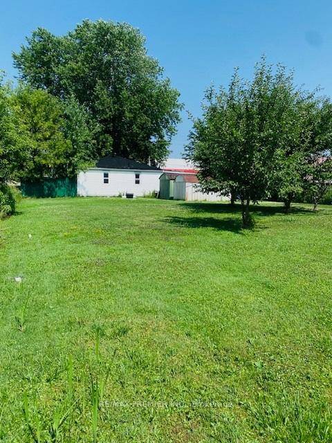 This charming bungalow sits on a stunning 75' x 200' lot, offering the perfect blend of peaceful country living with unbeatable convenience.