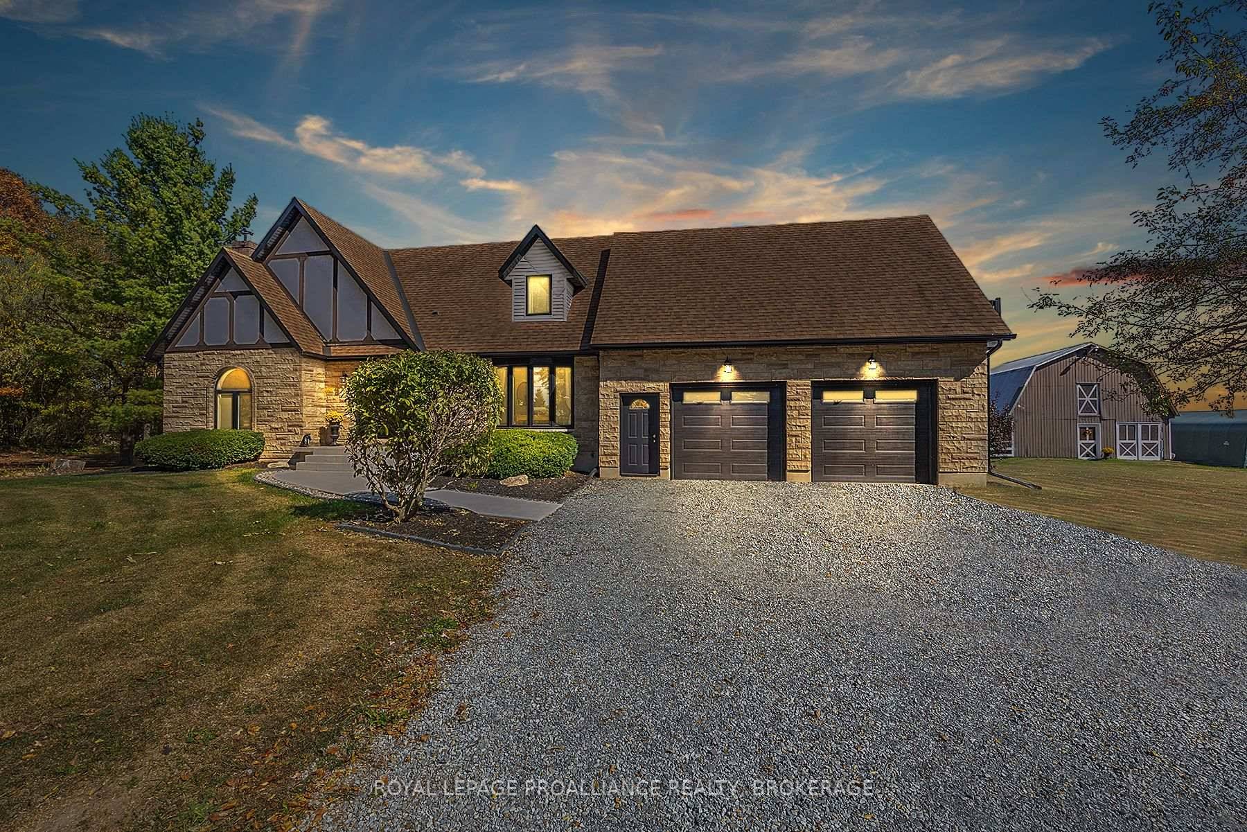 Elegant Tudor style residence nestled on over 3 acres, surrounded by breathtaking natural beauty and storybook charm.