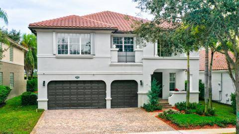 Spacious, serene and nicely updated family home in guard gated Cobblestone Creek of Boynton Beach.