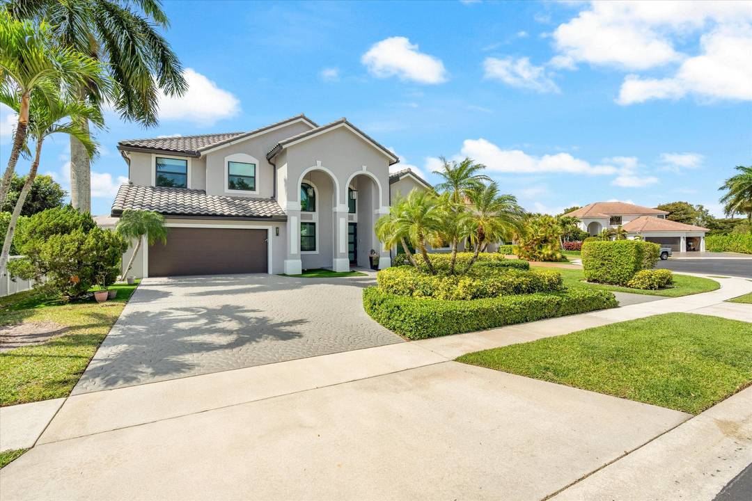 Rarely available and fully reimagined estate in the prestigious gated community of Boca Falls.