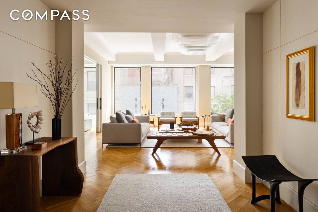 Welcome to this exceptional full floor residence in prime Greenwich Village, which includes a rare deeded parking space.