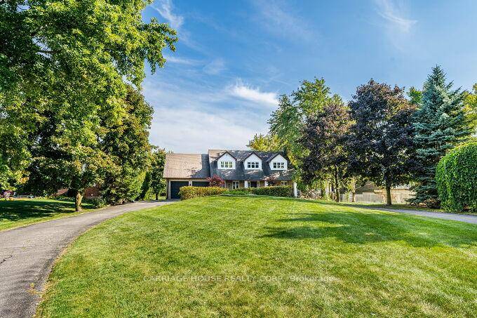 Presenting an exquisite Cape Cod style estate, fully updated and sited on a coveted one acre parcel just minutes from the prestigious Glen Williams Hamlet.