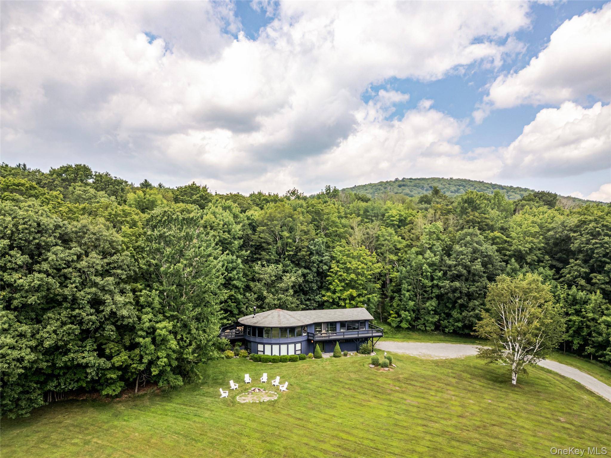 Welcome to Round Haus Chalet, a high design retro retreat set on five acres with spectacular 360 degree views, just minutes from Windham Mountain.