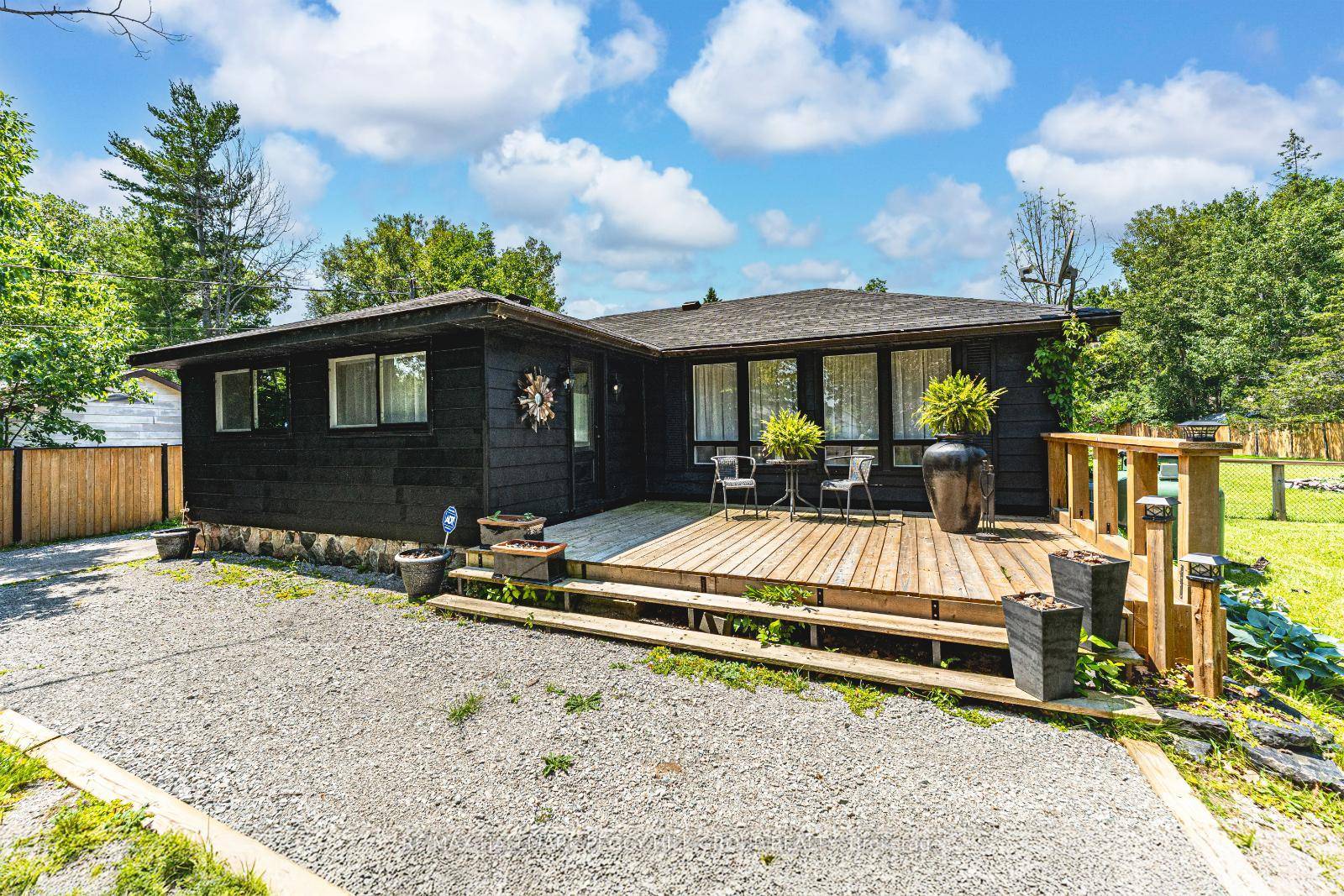 LAKE LIFE STARTS HERE ! UPDATED HOME ON OVER HALF AN ACRE WITH A DETACHED GARAGE !