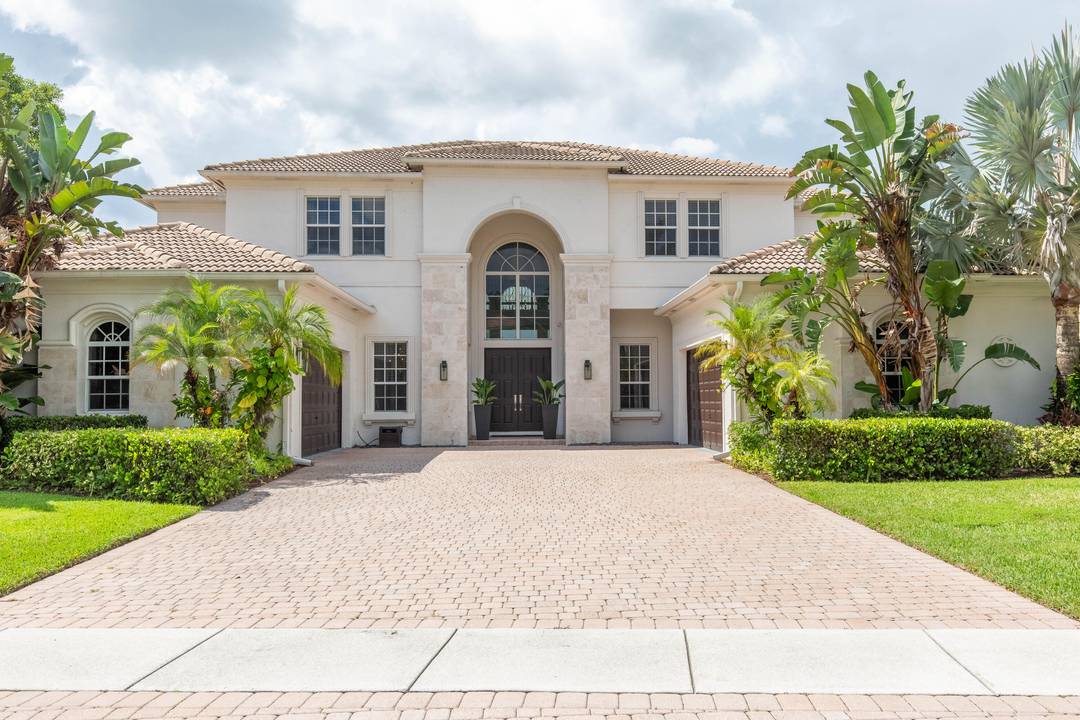 Nestled in a distinguished gated community, this exquisite 5 bed 5 bath waterfront pool home embodies luxury living at its finest !