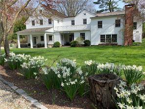Idyllic and charming country home with beautiful grounds in Old Hill section of Westport, perfect for a splendid summer with family and friends.