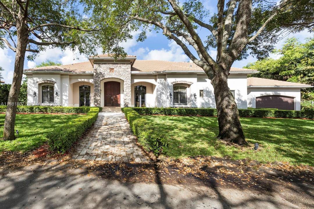Custom built 2007 estate in the highly sought after Glenvar Heights neighborhood, offering exceptional craftsmanship and designed for both comfortable living and entertaining.